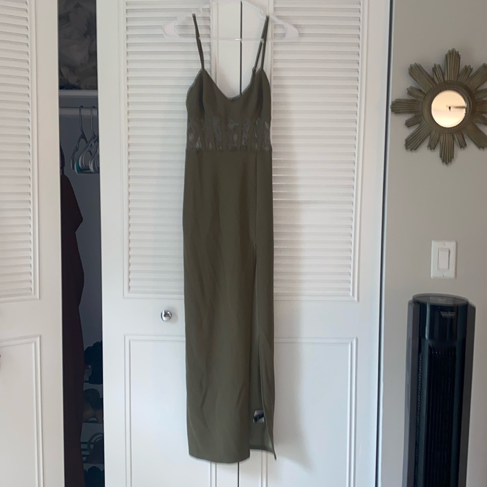 Long green dress with leg slit and lace torso